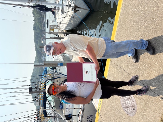 Sue Fisher holding a certificate